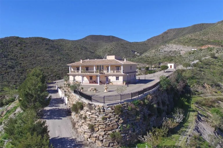 swinger mansion front view